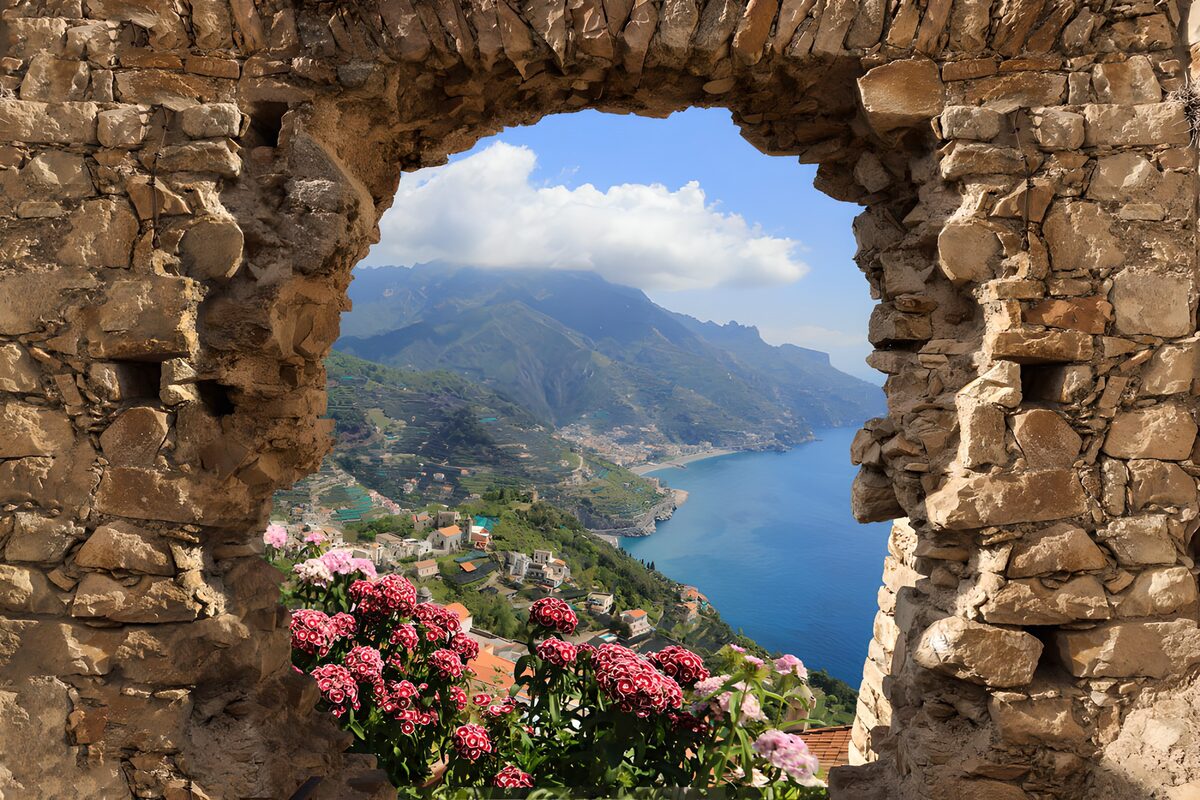 PDGIT4307075: Arco in pietra, fiori e mare azzurro