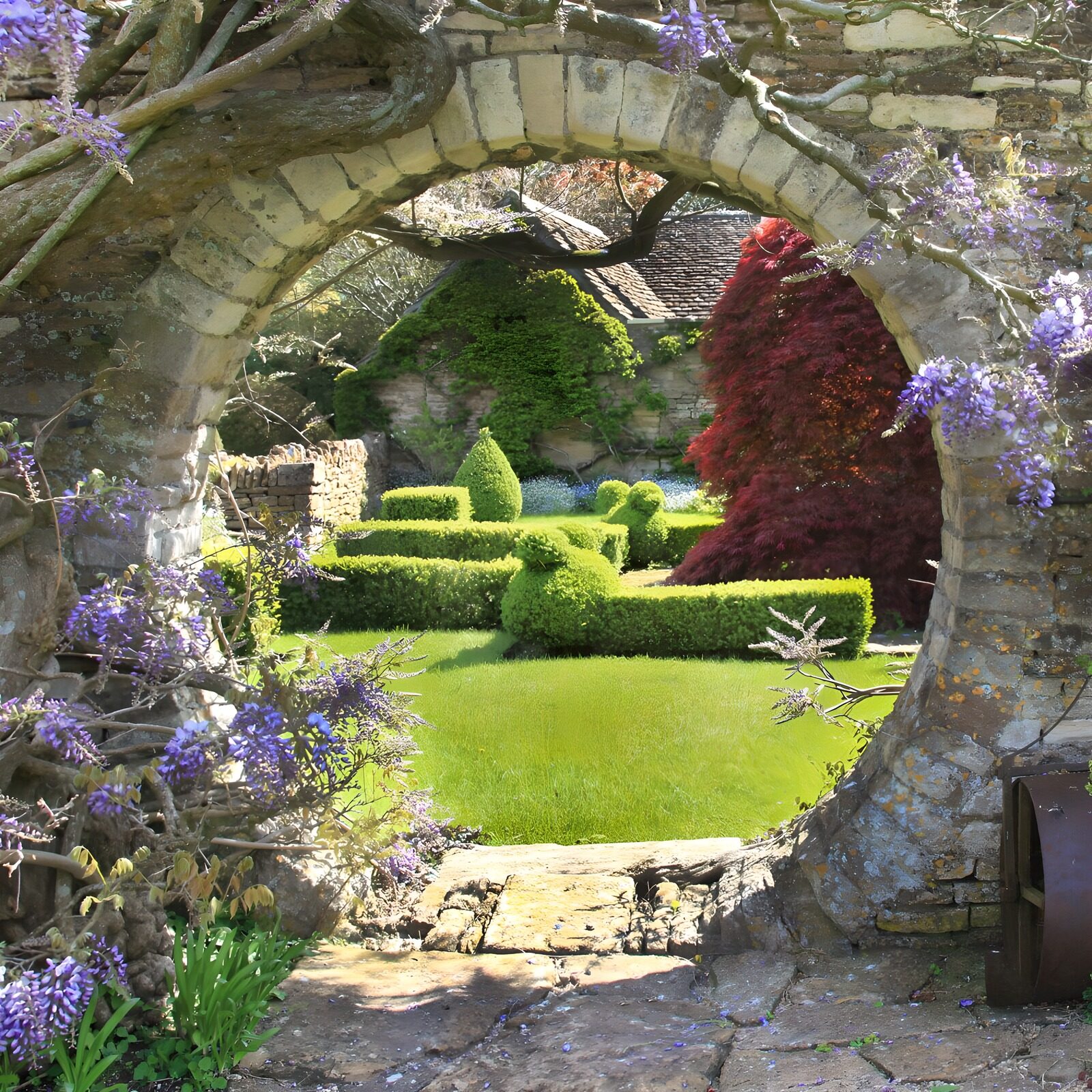 PDGIT4001833: Arco in pietra sul giardino di primavera